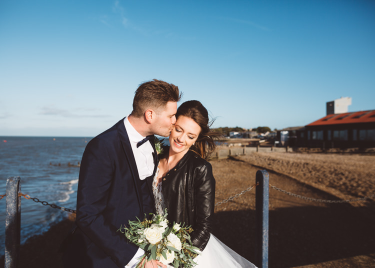 Bride Bridal Hayley Paige Dress Gown Tulle Princess Tuxedo Groom Waistcoat Navy Bow Tie Bouquet Ribbon Leather Jacket Cool Stylish Windy Coastal Wedding East Quay Lobster Shack Whitstable http://holliecarlinphotography.com/