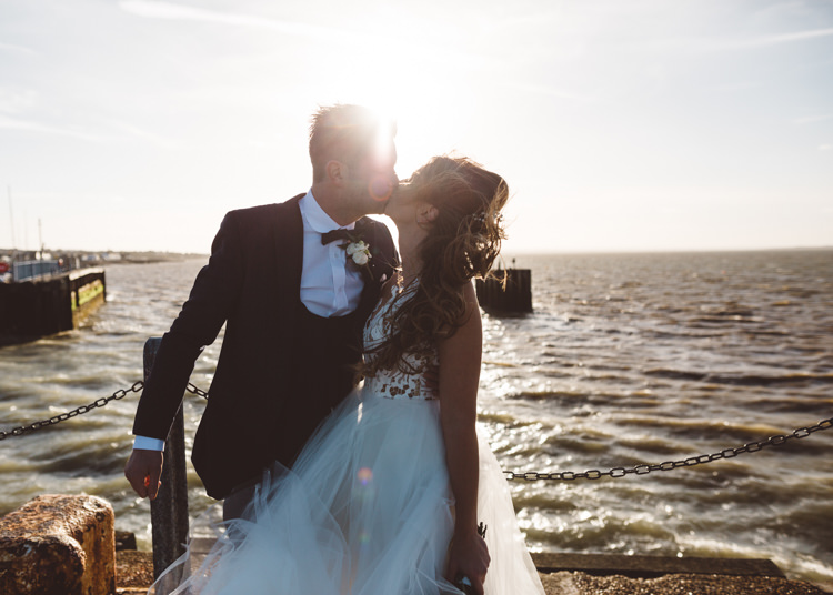 Bride Bridal Hayley Paige Dress Gown Tulle Princess Tuxedo Groom Waistcoat Navy Bow Tie Bouquet Ribbon Cool Stylish Windy Coastal Wedding East Quay Lobster Shack Whitstable http://holliecarlinphotography.com/