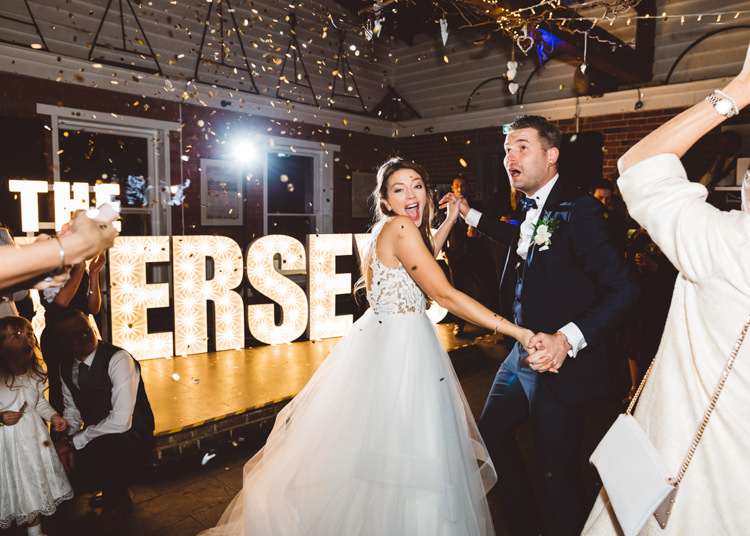 Bride Bridal Hayley Paige Dress Gown Tulle Princess Tuxedo Groom Waistcoat Navy Bow Tie Light Up Letters Confetti Cannon First Dance Cool Stylish Windy Coastal Wedding East Quay Lobster Shack Whitstable http://holliecarlinphotography.com/