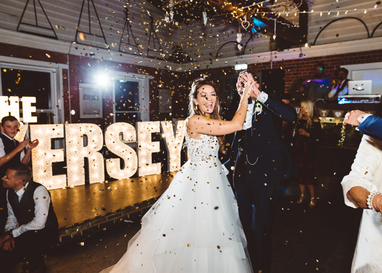Bride Bridal Hayley Paige Dress Gown Tulle Princess Tuxedo Groom Waistcoat Navy Bow Tie Light Up Letters Confetti Cannon First Dance Cool Stylish Windy Coastal Wedding East Quay Lobster Shack Whitstable http://holliecarlinphotography.com/