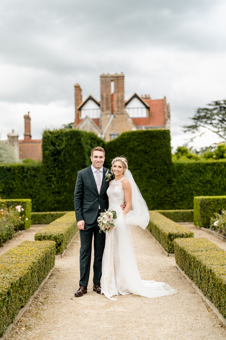 Lace Keyhole Neck Fitted Pronovias Dress Gown Bride Bridal Faux Flower Crown Veil Bouquet Ribbon Reiss Groom Suit Bottle Green Nostalgic Honest British Loseley Park Wedding Surrey https://www.johnbarwoodphotography.co.uk/