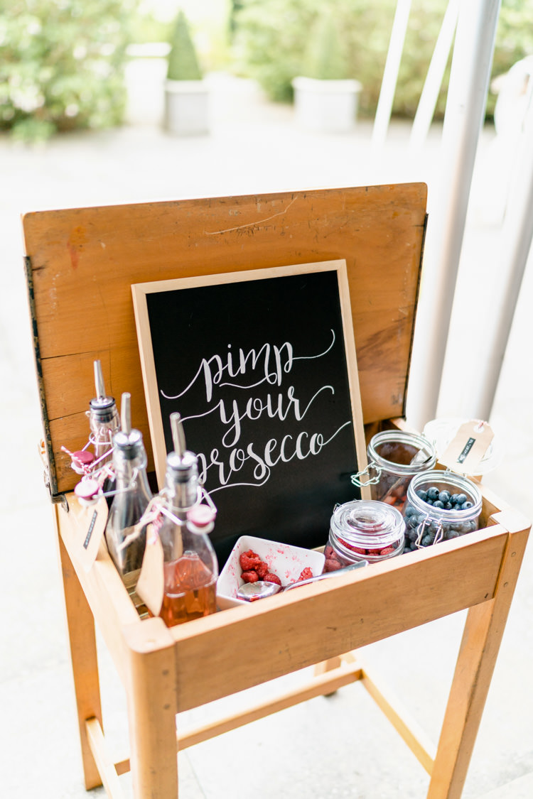 Pimp Your Prosecco Vintage School Desk Nostalgic Honest British Loseley Park Wedding Surrey https://www.johnbarwoodphotography.co.uk/