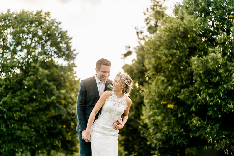 Lace Keyhole Neck Fitted Pronovias Dress Gown Bride Bridal Faux Flower Crown Veil Reiss Groom Bottle Green Suit Nostalgic Honest British Loseley Park Wedding Surrey https://www.johnbarwoodphotography.co.uk/