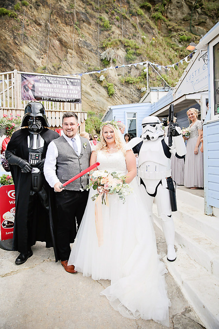 Bride Bridal Dress Gown Lace V Neck Cap Sleeve Pink Peach Bouquet Groom Waistcoat Tweed Grey Flower Foliage Crown Pink Peach Bouquet Star Wars Storm Trooper Darth Vader Pretty Sparkly Lusty Glaze Beach Cornwall Wedding http://victoriamitchellphotography.com/
