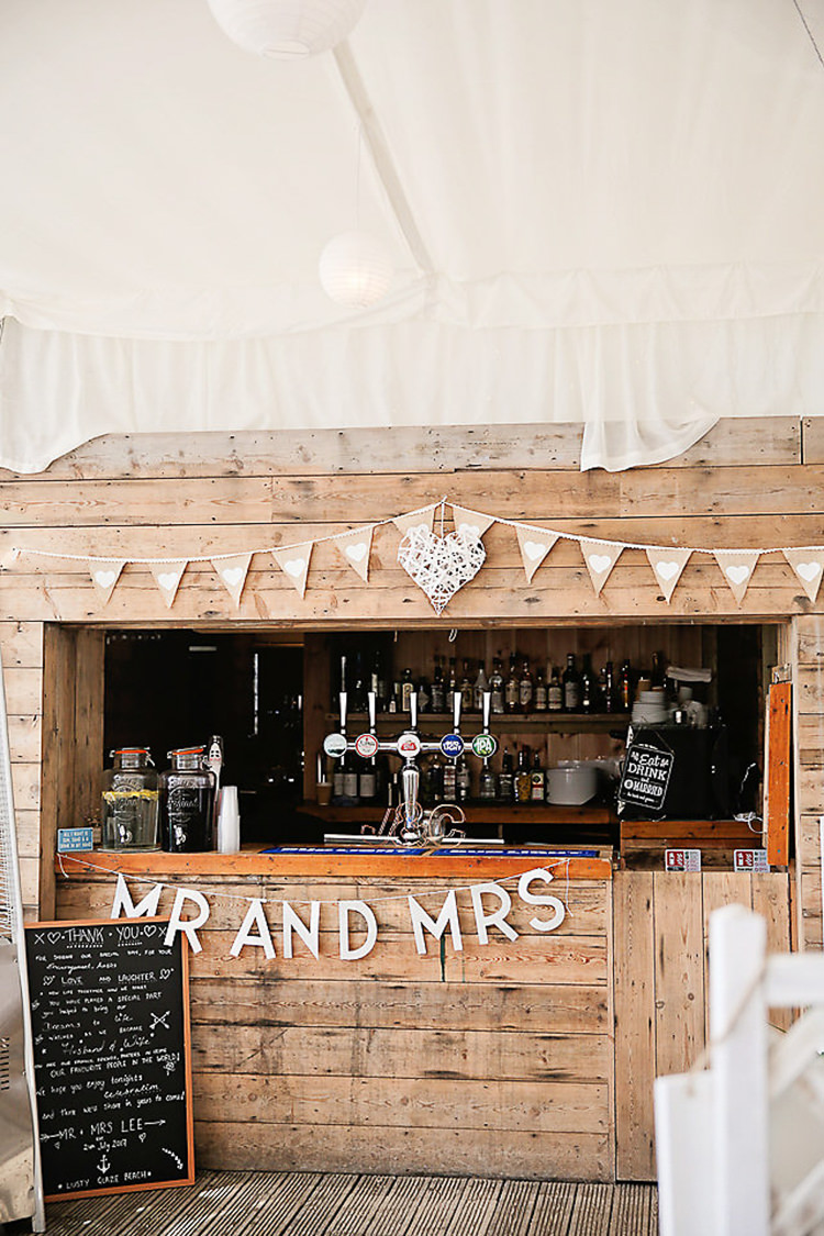 Wooden Shed Bar Bunting Mr & Mrs Chalkboard Menu Pretty Sparkly Lusty Glaze Beach Cornwall Wedding http://victoriamitchellphotography.com/