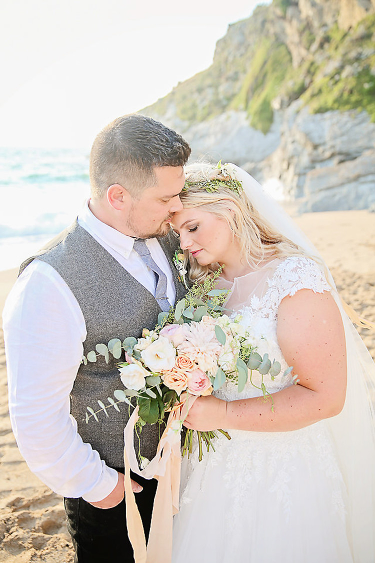 Bride Bridal Dress Gown Lace V Neck Cap Sleeve Pink Peach Bouquet Groom Waistcoat Tweed Grey Flower Foliage Crown Bouquet Pink Peach Rose Eucalyptus Pretty Sparkly Lusty Glaze Beach Cornwall Wedding http://victoriamitchellphotography.com/