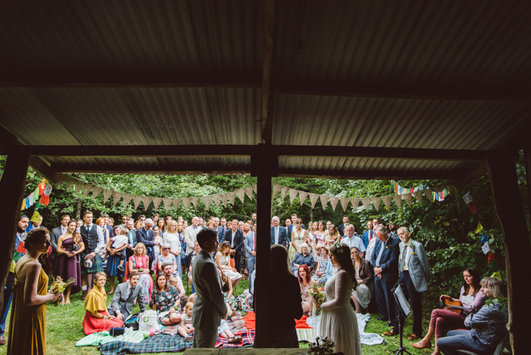 Bride Bridal Lace long Sleeved Dress Gown V Neck Wild Flower Bouquet Yellow Dip Dye Underskirt Groom Grey Suit Shed Bunting Prayer Flags Woodland Organic Farm Shop Wedding Gloucestershire https://www.edgodden.co.uk/