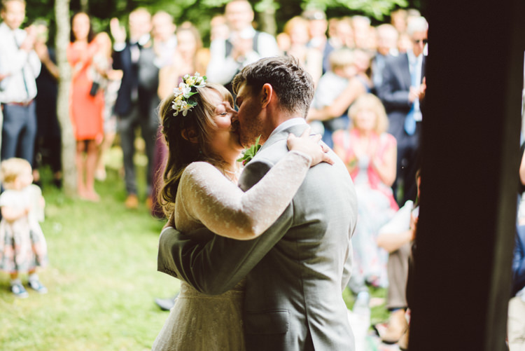 Bride Bridal Lace long Sleeved Dress Gown V Neck Wild Flower Crown Yellow Dip Dye Underskirt Grey Groom Suit Kiss Woodland Organic Farm Shop Wedding Gloucestershire https://www.edgodden.co.uk/