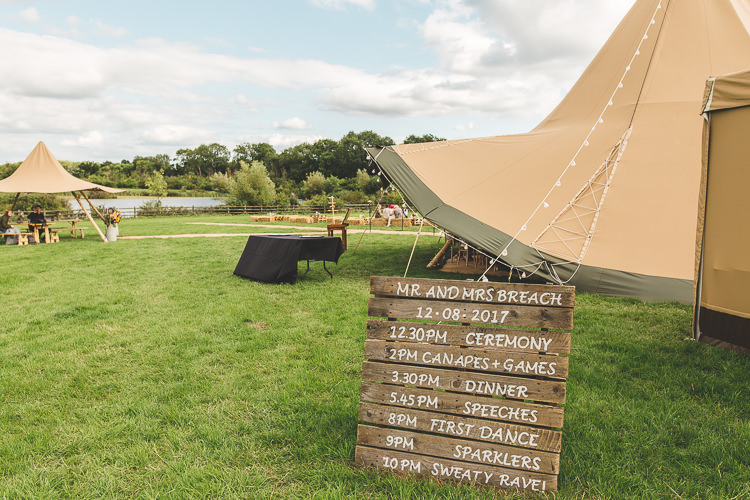 Welcome Sign Pallet Timeline Timings Colourful Outdoor Tipi Farm Wedding https://kirstymackenziephotography.co.uk/