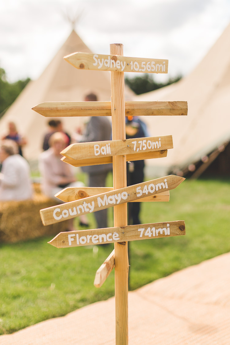 Signpost Wooden Sign Directions Colourful Outdoor Tipi Farm Wedding https://kirstymackenziephotography.co.uk/