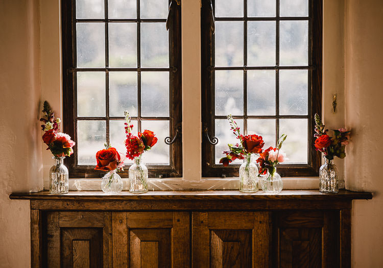 Glass Bottles Flowers Red Pink Roses Raucous Artistic Wintry Wedding Voewood Norfolk https://www.luisholden.com/