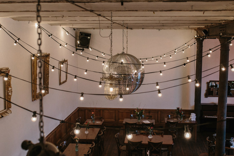 Festoon Lights Disco Ball Luxe Industrial Velvet Wedding Ideas https://jessypapasavvaphotography.com/