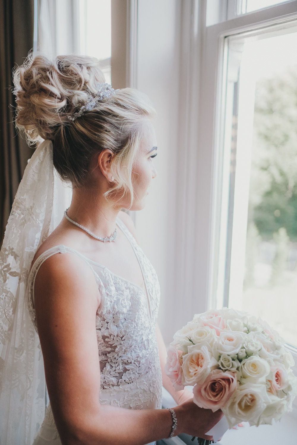 Happy Bride Bridal Prep Morning Hair Updo Classic Traditional Elegant Round White Rose Bouquet | Ashfield House Wedding Kate McCarthy Photography