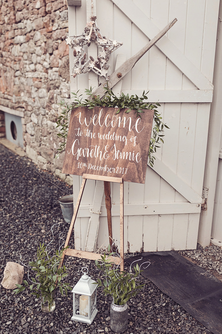 Hand Painted Personalised Sign Modern Calligraphy Rustic Welcome Sign Easel Greenery Foliage Magical Wonderland Askham Hall Wedding Winter Tiree Dawson Photography