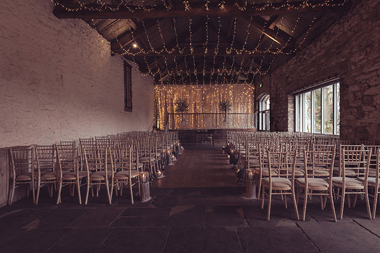 Ceremony Pea Fairy Light Backdrop Candles Magical Wonderland Askham Hall Wedding Winter Tiree Dawson Photography