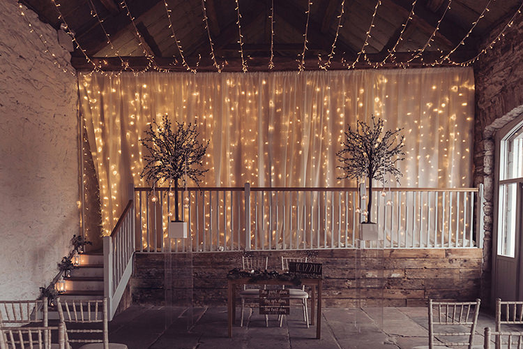 Ceremony Pea Fairy Light Backdrop Candles Magical Wonderland Askham Hall Wedding Winter Tiree Dawson Photography