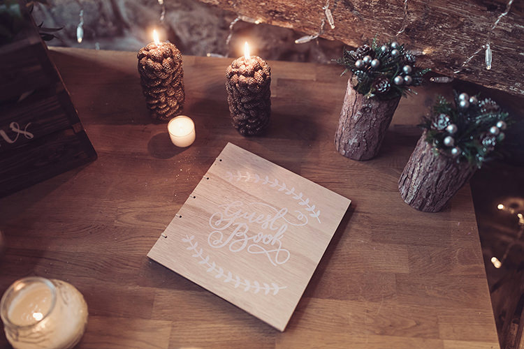 Wooden Guest Book Sparkling Berries Candle Log Wood Slice Magical Wonderland Askham Hall Wedding Winter Tiree Dawson Photography