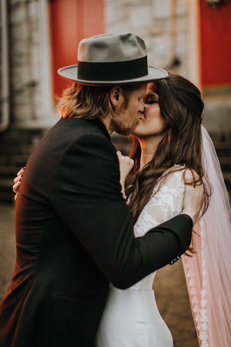 Warehouse Rustic Chic Refined Street Photography Groom Bride Kiss | Boho Industrial Winter Wedding Lunalee Photography