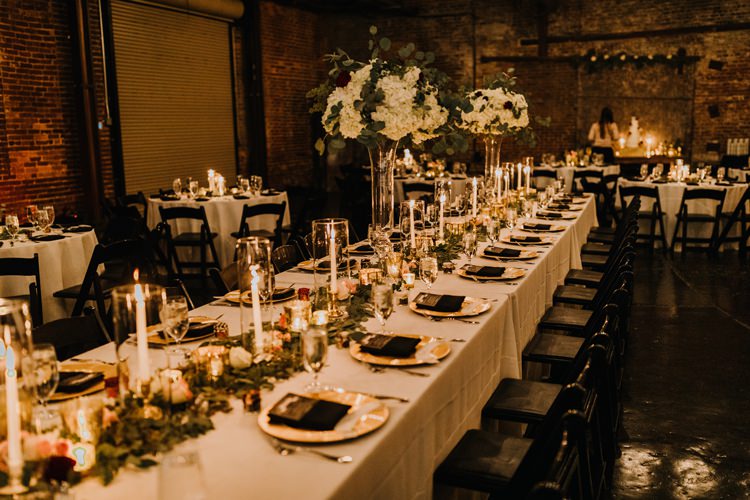 Warehouse Rustic Chic Refined Atlanta King Plow Wedding Table Black Chairs White Flowers | Boho Industrial Winter Wedding Lunalee Photography