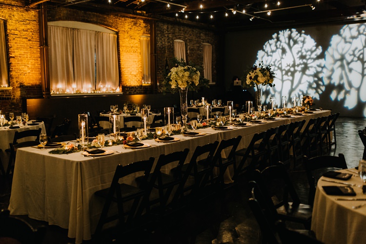 Warehouse Rustic Chic Refined Atlanta King Plow Wedding Table Black Chairs White Flowers | Boho Industrial Winter Wedding Lunalee Photography