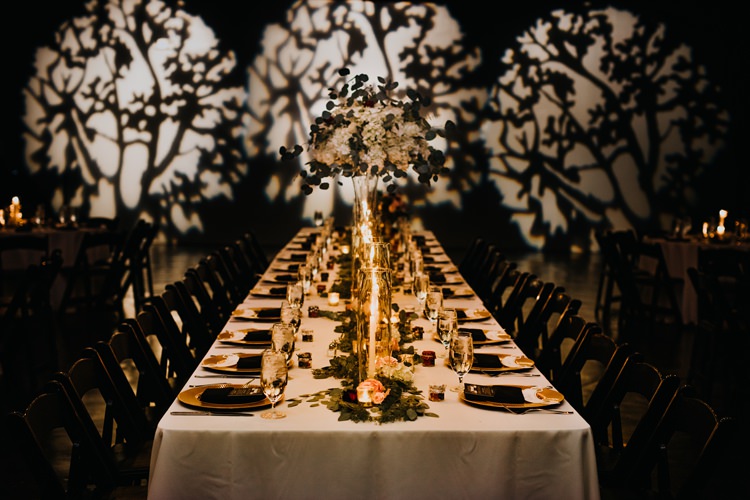 Warehouse Rustic Chic Refined Atlanta King Plow Wedding Table Black Chairs White Flowers Light Show | Boho Industrial Winter Wedding Lunalee Photography