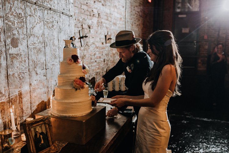 Warehouse Rustic Chic Refined Atlanta King Plow Bride Groom Wedding Cake Cut | Boho Industrial Winter Wedding Lunalee Photography