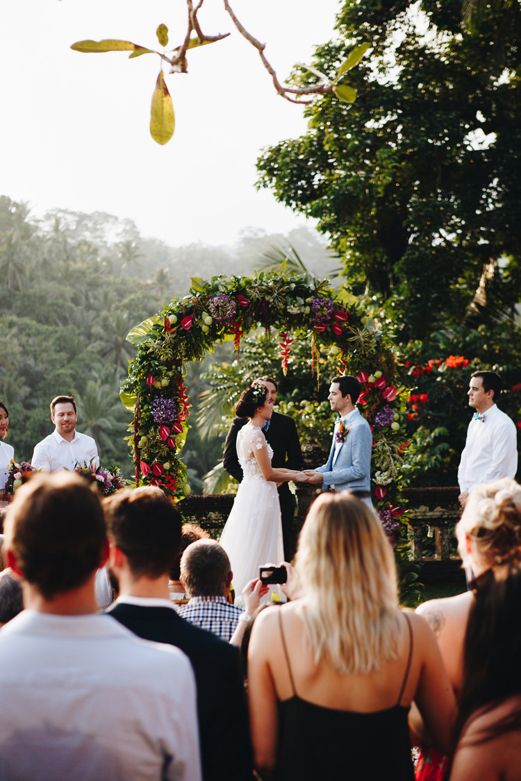 Outdoor Destination Luxury Adventure Ubud Ceremony Bride Colorful Flower Crown Tropical Floral Arch | Whimsical Exotic Tropical Jungle Wedding Bali http://www.cecilephotographybali.com/