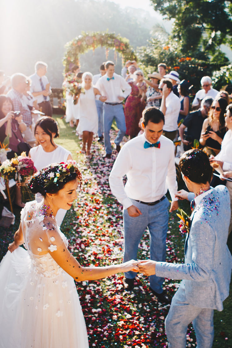 Outdoor Destination Luxury Adventure Ubud Ceremony Bride Colorful Flower Crown Tropical Floral Arch Confetti | Whimsical Exotic Tropical Jungle Wedding Bali http://www.cecilephotographybali.com/