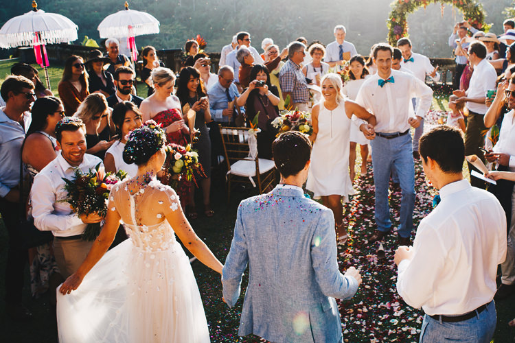 Outdoor Destination Luxury Adventure Ubud Ceremony Bride Colorful Flower Crown Tropical Floral Arch Confetti | Whimsical Exotic Tropical Jungle Wedding Bali http://www.cecilephotographybali.com/