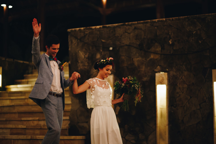 Outdoor Destination Luxury Adventure Ubud Colorful Tropical Flower Crown Bride Groom First Entrance | Whimsical Exotic Tropical Jungle Wedding Bali http://www.cecilephotographybali.com/
