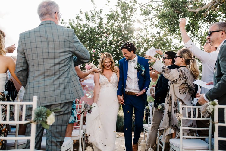 Spain Sun Outdoor Tropical Mediterranean Garden Villa Outdoor Ceremony Bride Groom Aisle | Ibiza Destination Wedding Amy Faith Photography