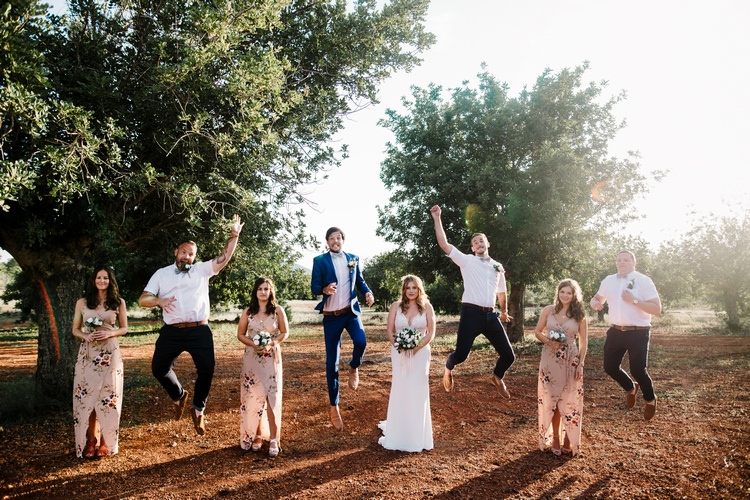 Spain Sun Outdoor Tropical Mediterranean Garden Villa Bride Bridesmaids Groom Groomsmen Jump | Ibiza Destination Wedding Amy Faith Photography
