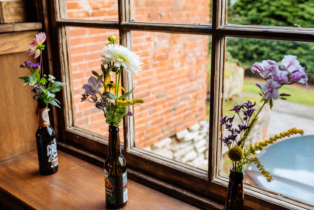 Beer Bottle Vases Florals Flowers Laid Back Harry Potter Wedding Daffodil Waves Photography