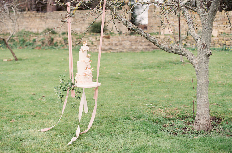 Blush Pink Gold Flower Cake Ribbon Swing Table Stand Whimsical Summer Chocolat Wedding Ideas Brympton House Liz Baker Fine Art Photography