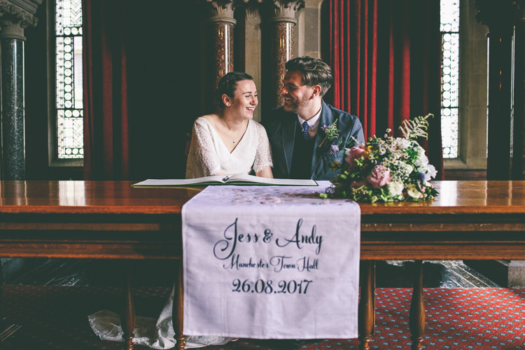 Lace Bat Wing Sleeve Bride Bridal Dress Gown Blue Suit Groom Bespoke Tablecloth Register Table Signing Manchester Town Hall Wedding City Emma Boileau Photography