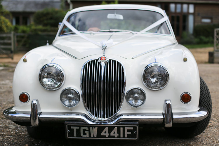 Bride Transport Ribbon Vintage Car Manor Farm Wedding Hampshire Luke Doyle Photography
