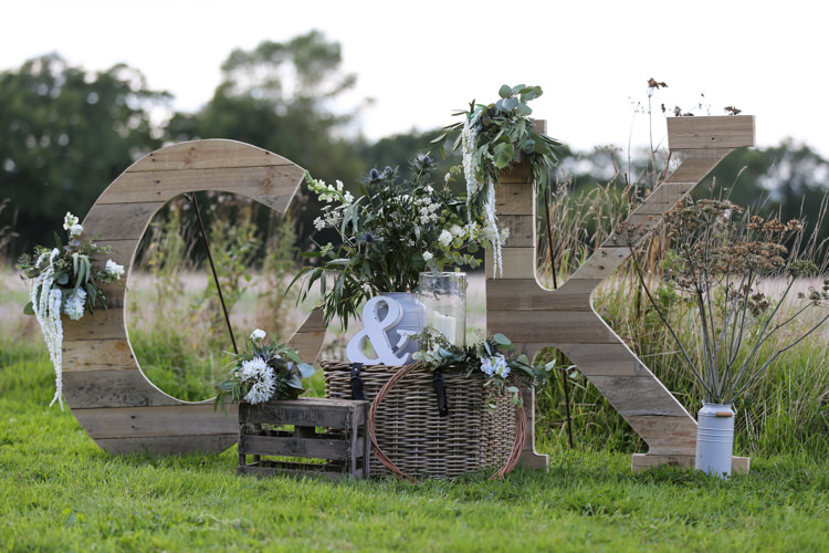 Giant Wooden Letters Rustic Outdoor Floral Wooden Crates Wicker Basket Manor Farm Wedding Hampshire Luke Doyle Photography