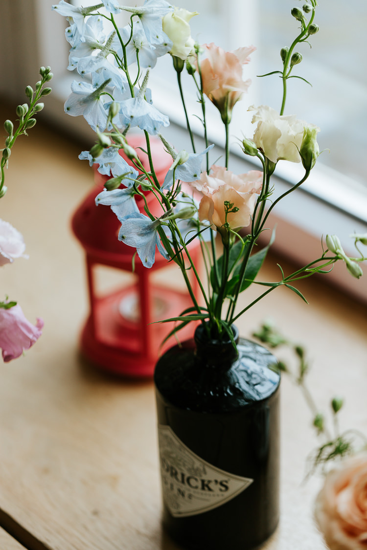 Delphiniums Roses Stocks Pink Blue White Flowers Gin Bottle Pretty Pastel Floral Village Hall Wedding Struve Photography