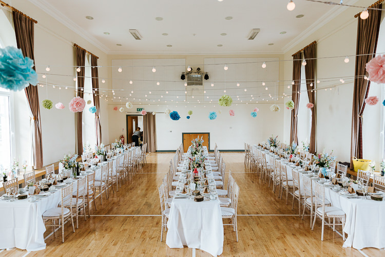 Festoon Lights Pom Poms Decor Long Tables Pretty Pastel Floral Village Hall Wedding Struve Photography