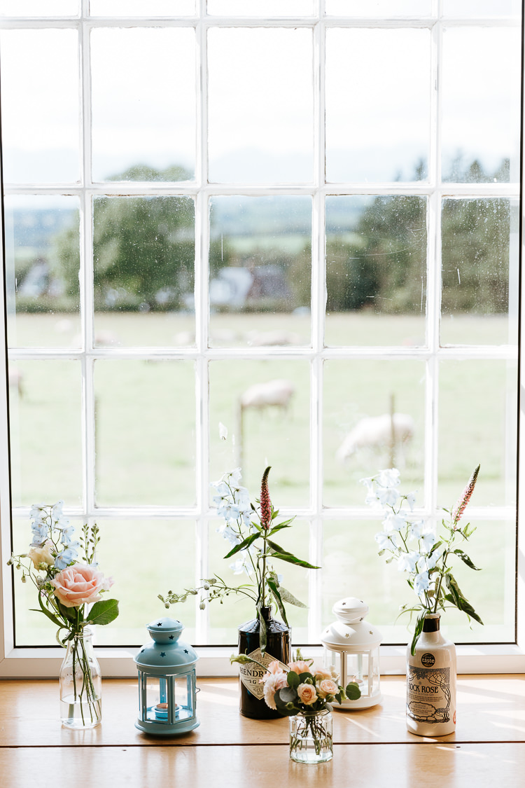 Gin Bottle Flowers Pink Blue Windowsill Pretty Pastel Floral Village Hall Wedding Struve Photography