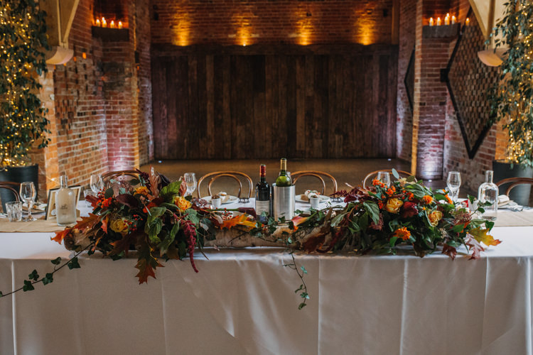 Top Table Foliage Flowers Florals Autumn Red Orange Shustoke Farm Barns Wedding Ellie Grace Photography