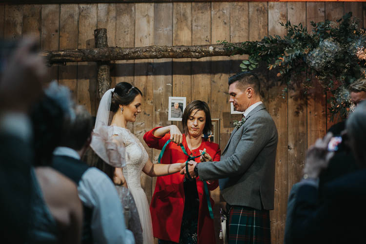 Ceremony Handfasting Bride Bridal Dress Gown Lace Sweetheart Neckline Short Sleeve Full Skirt Kilt Groom Tartan Waistcoat Red Green The Byre at Inchyra Wedding Jen Owens Images