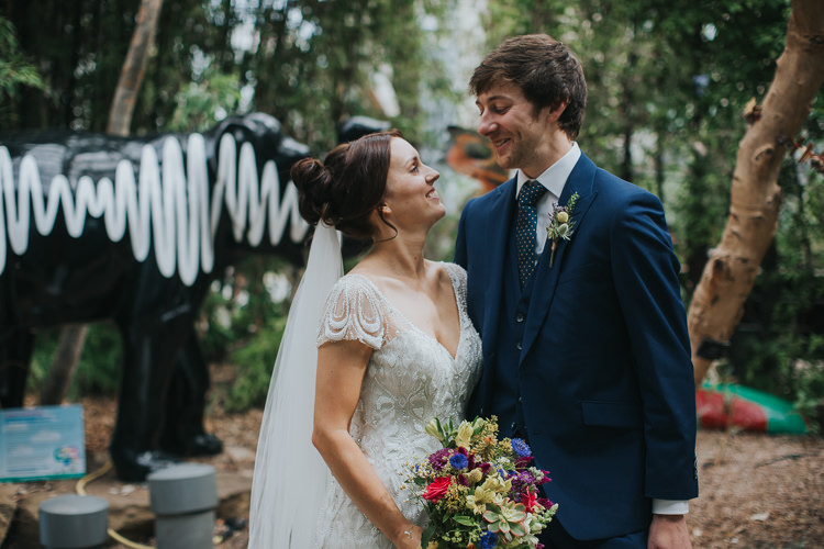 Bride Bridal Beaded Embellished Cap Short Sleeve Dress Sweetheart Neckline Bouquet Ribbons Blue Suit Groom The Workstation Cinema Colourful Wedding Bloom Weddings