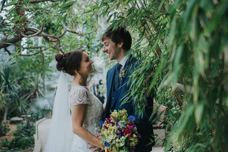 Bride Bridal Beaded Embellished Cap Short Sleeve Dress Sweetheart Neckline Bouquet Ribbons Blue Suit Groom The Workstation Cinema Colourful Wedding Bloom Weddings