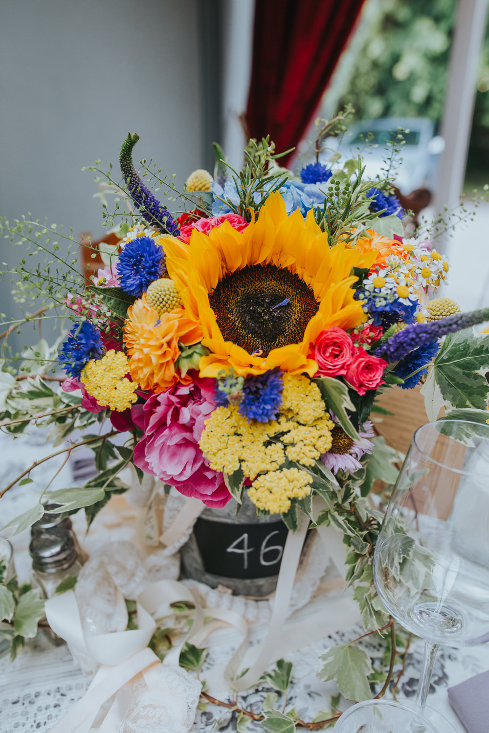 Flowers Peony Hydrangea Sunflower Daisy Cornflowers Craspedia Bucket Table Colourful Bright Summer Pub Wedding Charlotte Razzell Photography