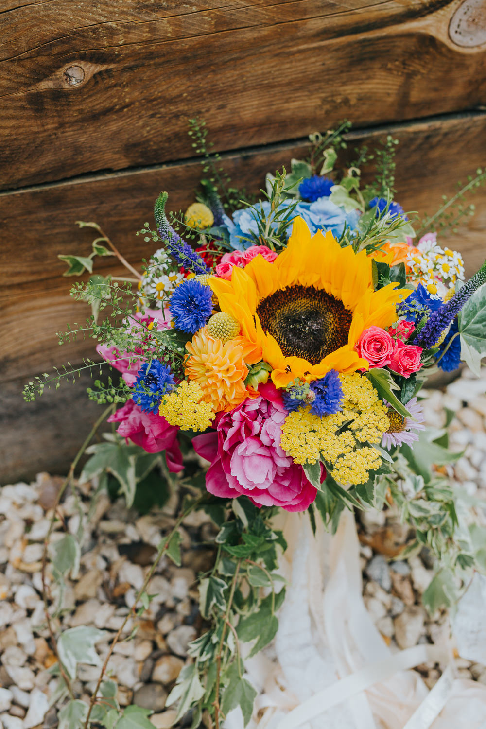 Bouquet Flowers Bride Bridal Peony Hydrangea Sunflower Daisy Cornflowers Craspedia Ribbons Colourful Bright Summer Pub Wedding Charlotte Razzell Photography