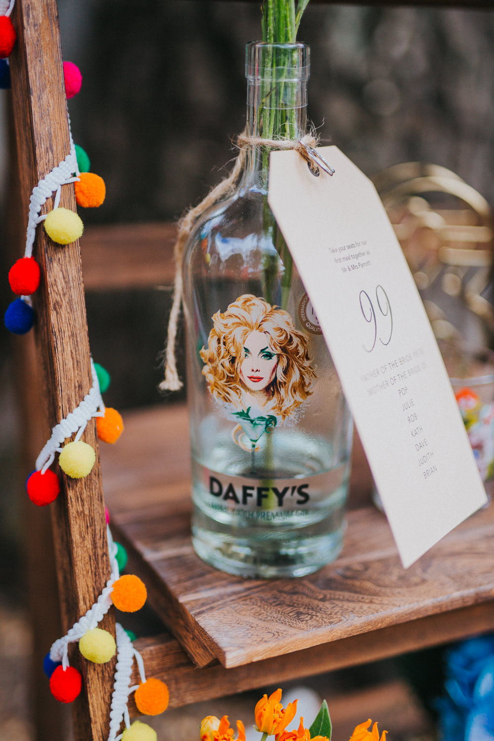 Gin Bottle Seating Plan Table Chart Flowers Wooden Ladder Colourful Bright Summer Pub Wedding Charlotte Razzell Photography
