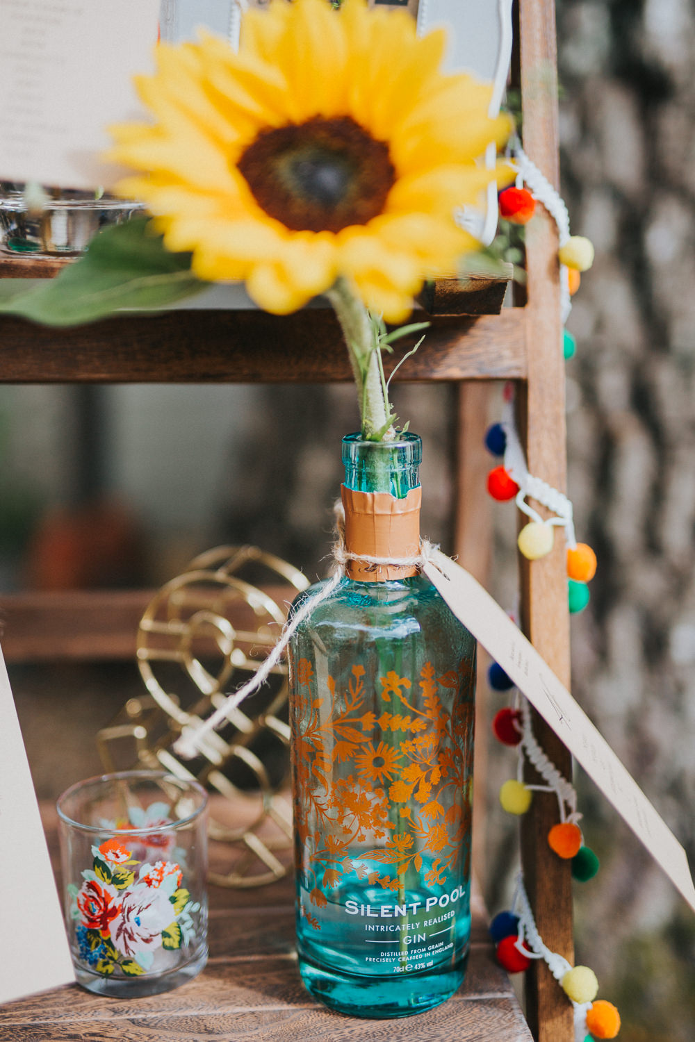 Gin Bottle Seating Plan Table Chart Flowers Wooden Ladder Colourful Bright Summer Pub Wedding Charlotte Razzell Photography