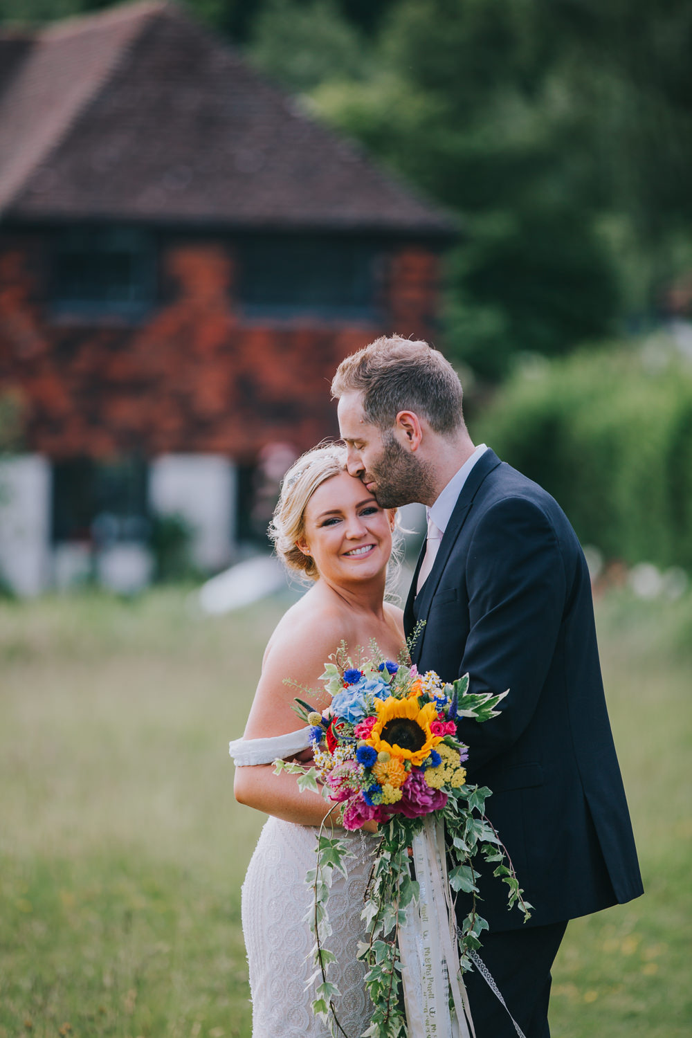 Bouquet Flowers Bride Bridal Peony Hydrangea Sunflower Daisy Cornflowers Craspedia Ribbons Colourful Bright Summer Pub Wedding Charlotte Razzell Photography