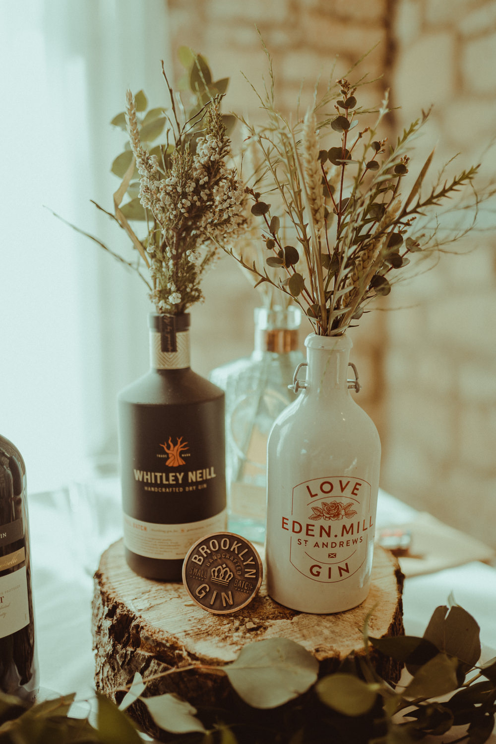 Gin Bottles Log Slice Greenery Foliage Centrepiece Decor Northside Farm Wedding Belle Art Photography
